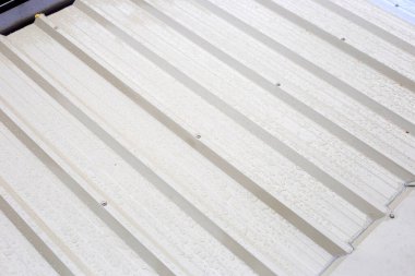 Roof with corner flashing and rain water gutter. Roof repair, steel sheet. Stop a roof leak