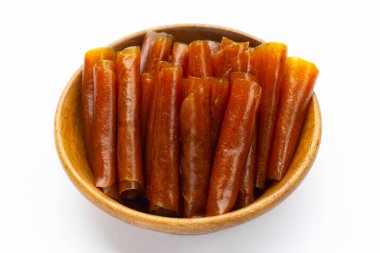 Dried mango paste sheets on white background.