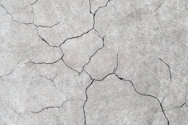 Arka plan için çatlamış çimento ya da beton yüzey dokusu.