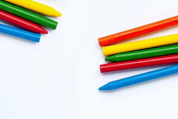 Colorful crayon on white background. Copy space