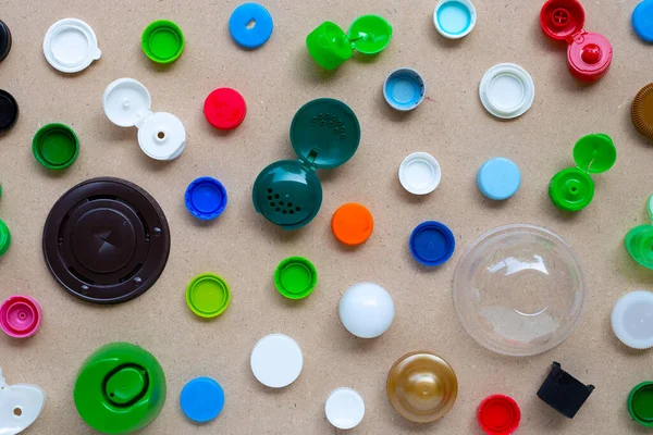 Colorful plastic bottle caps and plastic glass lid