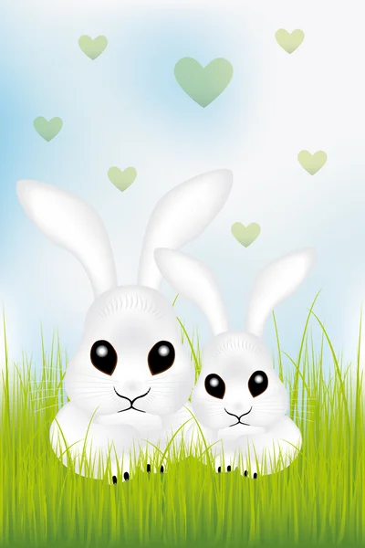 Adorable Easter rabbits in green grass — Stock Vector