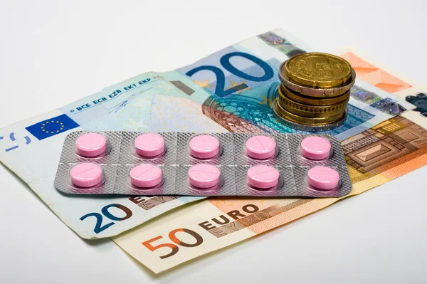 Geneesmiddelen en geld — Stockfoto