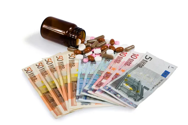 Geneesmiddelen en geld — Stockfoto