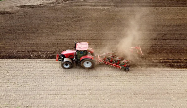 Farmer Plowing His Dry Farmland Spring Royaltyfria Stockfoton