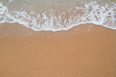 dalga deniz kum üzerinde