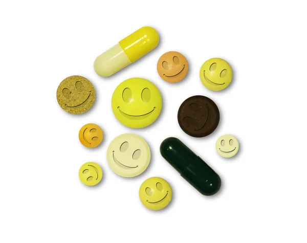 Tabletas con sonrisas sobre fondo blanco —  Fotos de Stock
