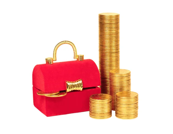 Red chest and columns of yellow coins — Stock Photo, Image