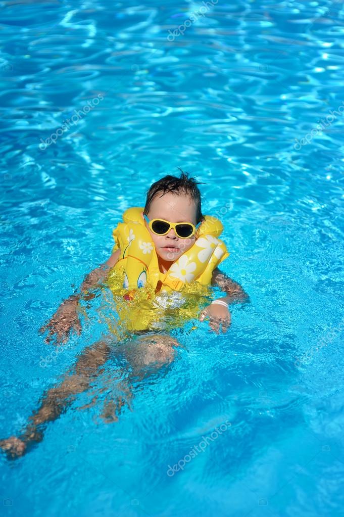 The boy bathes in pool — Stock Photo © Alekuwka 18734041
