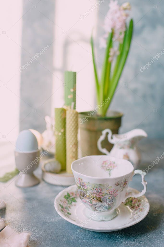 Spring Easter still life, Easter eggs in pastel colors with flowers