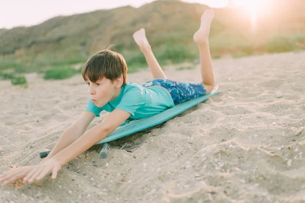 Child Jokingly Rides Ironing Board Instead Surfboard — Zdjęcie stockowe