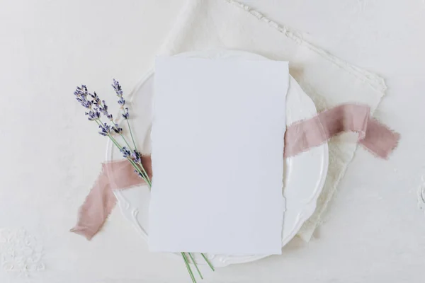 white blank sheet of paper on a plate, menu mockup, invitation mockup, business card or letter mockup