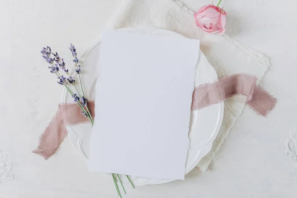 white blank sheet of paper on a plate, menu mockup, invitation mockup, business card or letter mockup