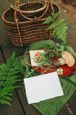invitation or greeting card mockup on a natural background in the forest, paper mockup on a forest background