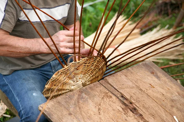 Hands of a basket maker at work