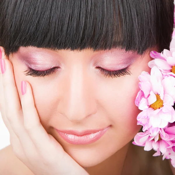 Young woman with flowers — Stock Photo, Image