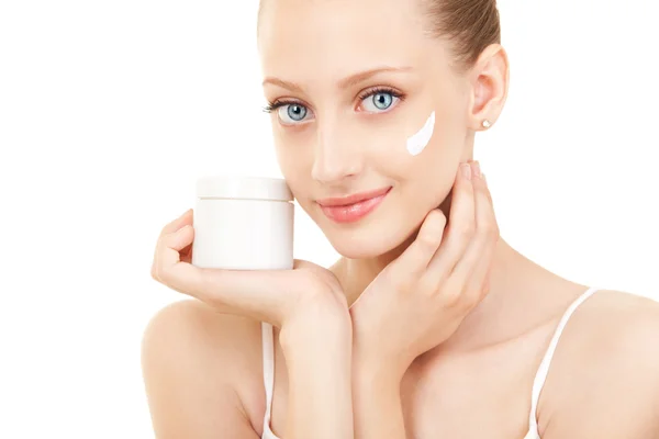 Cute woman applying cream to her face — Stock Photo, Image