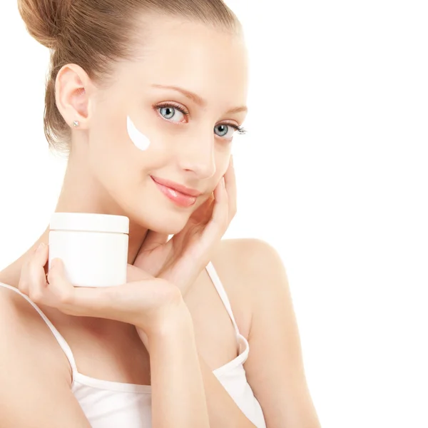 Cute woman applying cream to her face — Stock Photo, Image