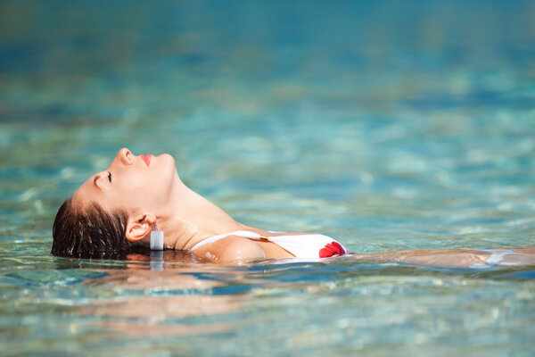 Young woman relaxing in the water