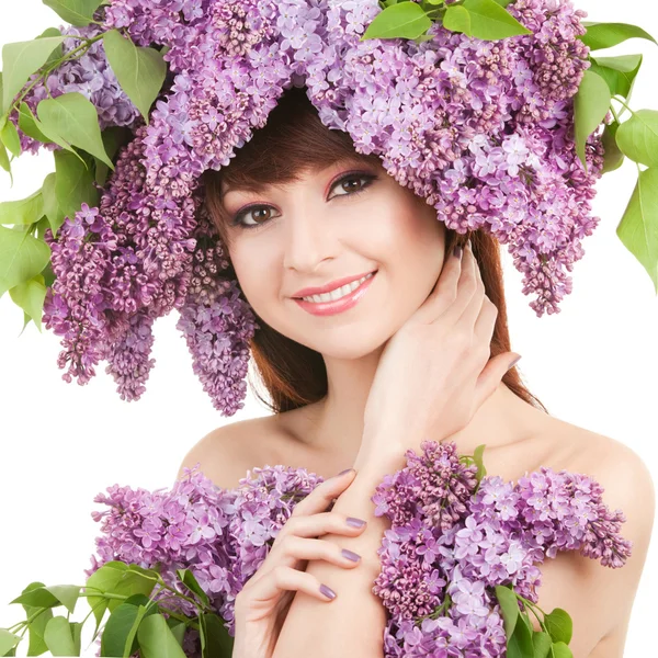 Mujer joven con flores lila —  Fotos de Stock