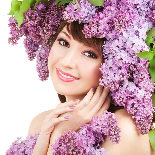 Mujer joven con flores lila —  Fotos de Stock