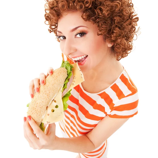 Mujer divertida con sándwich en el fondo blanco — Foto de Stock