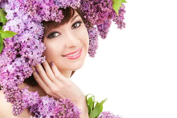 Mujer joven con flores lila —  Fotos de Stock