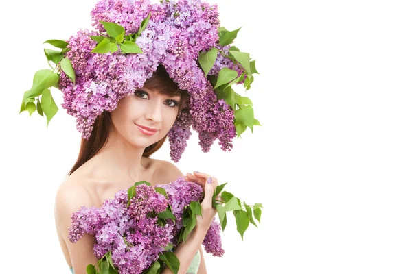 Young woman with flowers on white background — Stock Photo, Image