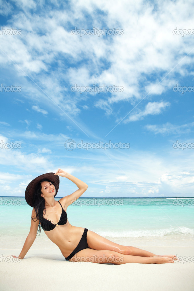Happy fashion woman on the beach