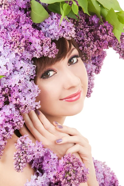 Mujer joven con flores lila —  Fotos de Stock