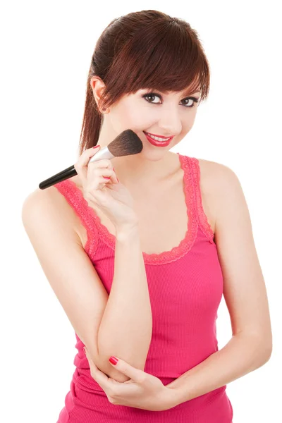 Jeune femme avec brosses pour maquillage isolé sur fond blanc — Photo