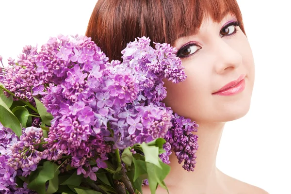 Young woman with lilac flowers — Stock Photo, Image