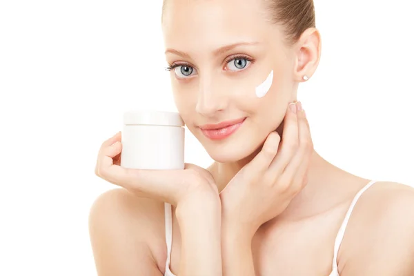 Cute woman applying cream to her face — Stock Photo, Image