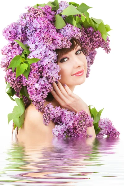 Mujer joven con flores lila —  Fotos de Stock