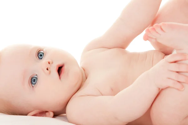 Söt baby med vackra blå ögon på den vita bakgrunden — Stockfoto