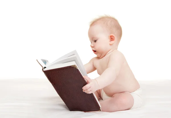 Cute baby with book on the white background Stock Picture