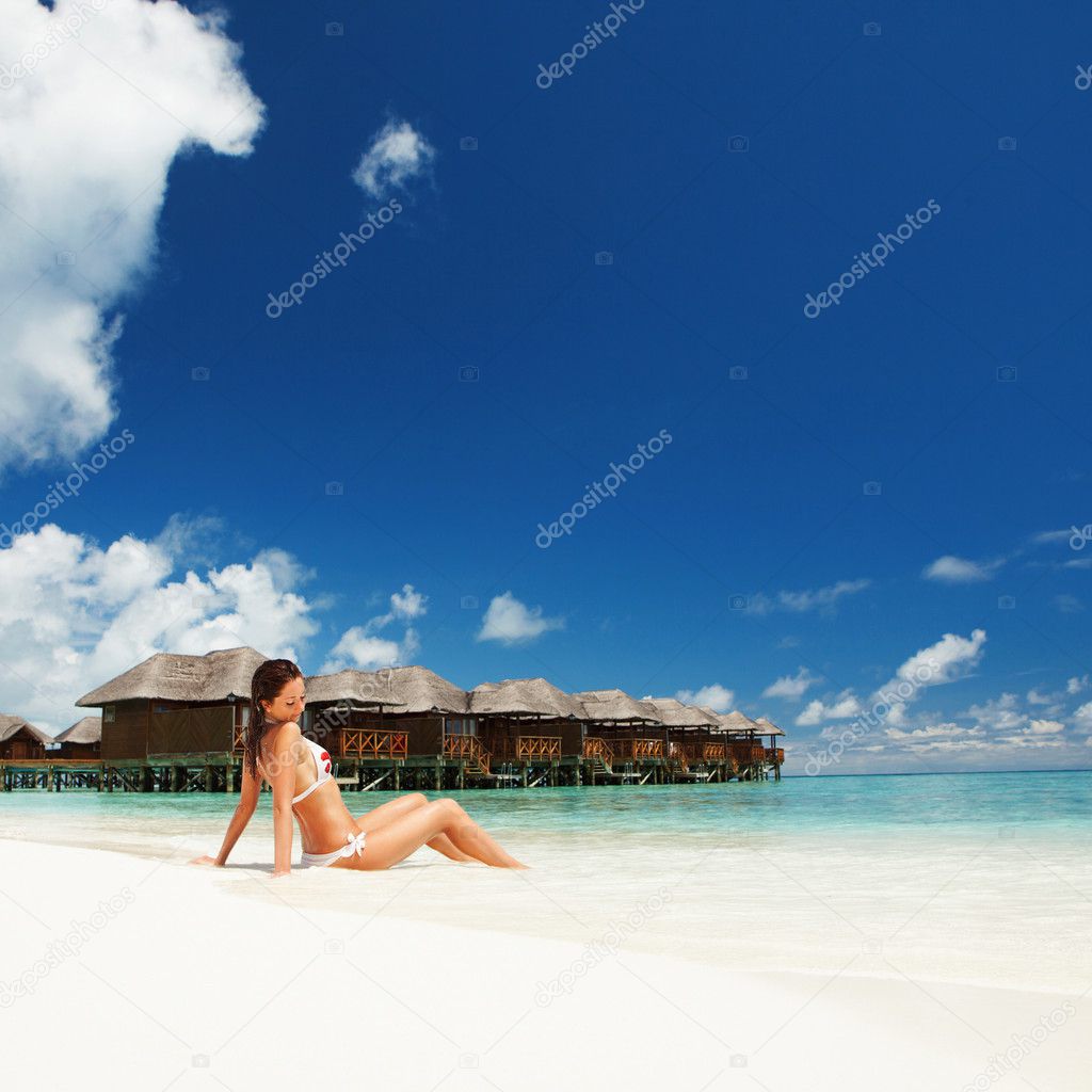 Cute woman relaxing on the tropical beach