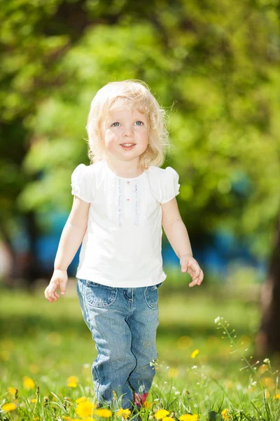 Cute little girl in the park Royalty Free Stock Photos