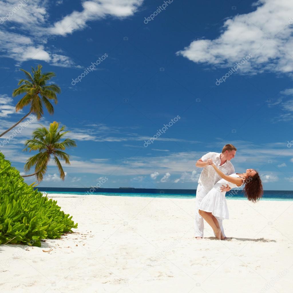 Happy couple on the tropical beach