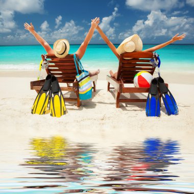 Happy couple on the beach of sea clipart