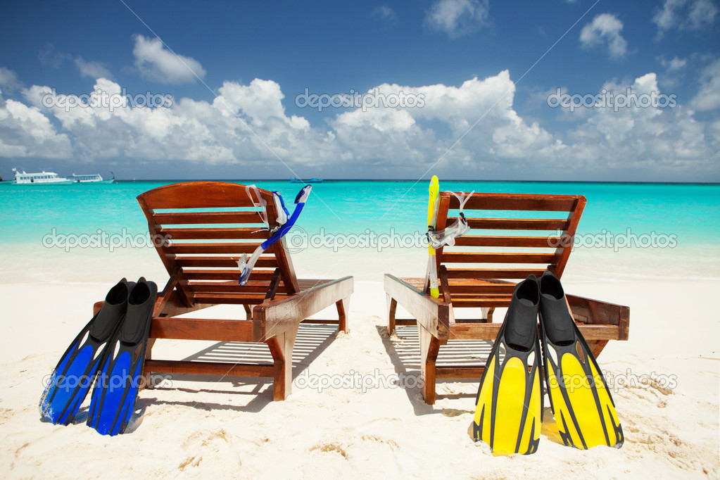 Two deckchairs on the tropical beach