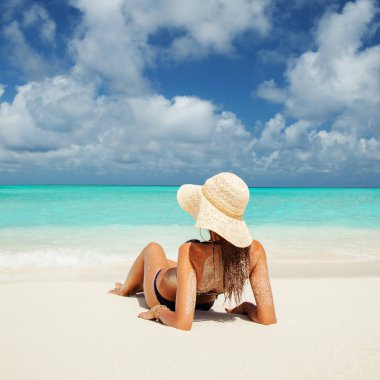 Young fashion woman relax on the beach clipart