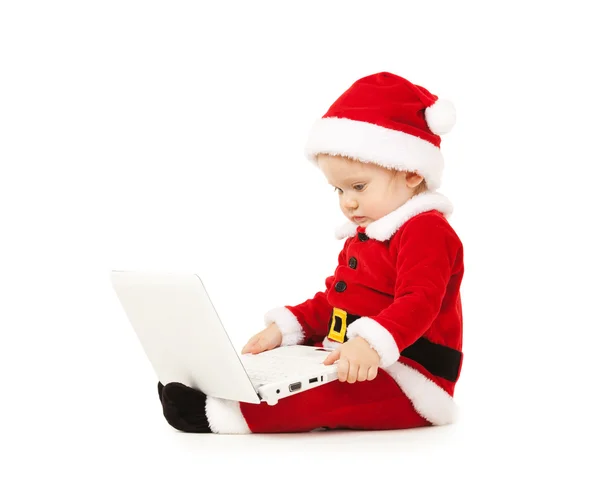 Niedliches Weihnachtsmann-Baby mit Laptop auf weißem Hintergrund — Stockfoto