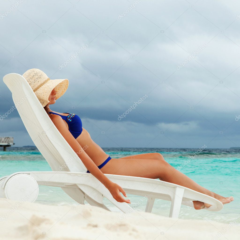 Pretty woman relaxing on the beach