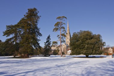 Salisbury cathedral after snow fall clipart
