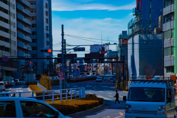 Calle en la ciudad de negocios en Shinjuku Tokio durante el día —  Fotos de Stock