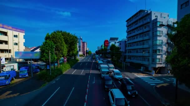 A timelapse of downtown street at Kanpachi avenue in Tokyo daytime wide shot zoom — Stock Video