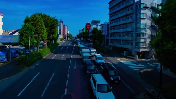 A timelapse of downtown street at Kanpachi avenue in Tokyo daytime wide shot panning — Stock Video