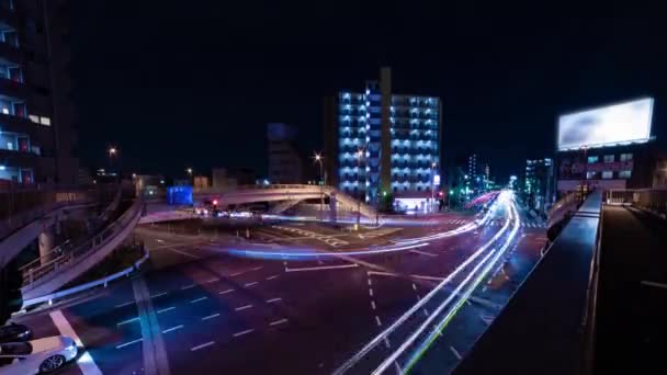東京の交差点での渋滞の夜のタイムラプスワイドショット傾き — ストック動画