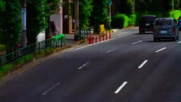 Sebuah timelapse jalan mobil di jalan Kanpachi di Tokyo siang hari tembakan panjang miring — Stok Video